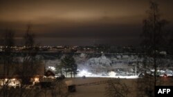 Rescue crews work at the site of a landslide and crater in Ask in Gjerdrum,on January 2, 2021, following a landslide in the town some 40 km northeast of the capital Oslo.