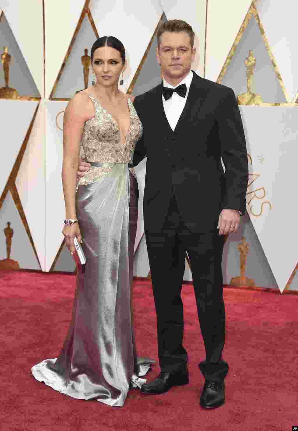 Luciana Barroso, left, and Matt Damon arrive at the Oscars on Feb. 26, 2017, at the Dolby Theatre in Los Angeles.