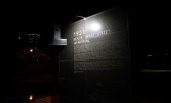 FILE - A monument to the 1921 Black Wall Street massacre is pictured in Tulsa, Oklahoma, June 18, 2020.