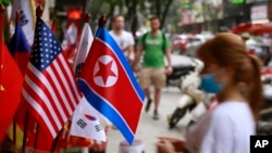 U.S and North Korean flags are on sale at a flag shop in Hanoi, Vietnam, Jan. 29, 2019. 