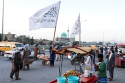 Taliban flags are seen on a street in Kabul, Afghanistan, Sept. 16, 2021