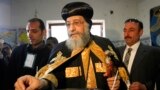 Pope Tawadros II, pope of the Coptic Orthodox church, casts his vote in a referendum on the new Egyptian constitution at a polling station in Cairo January 14, 2014. Egyptians began voting on Tuesday in a constitutional referendum, the first ballot since 