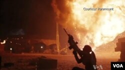 Chase and Brittany Boslet take pictures of smoke from the Las Pulgas fire burning on the Marine Corps Base Camp Pendleton near Oceanside, California, May 16, 2014.