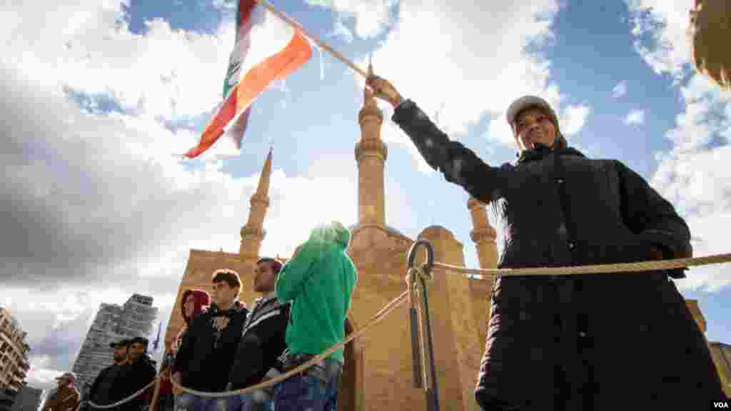 Supporters of Prime Minister Saad Hariri celebrate his return outside Beirut's central mosque, and near the tomb of Saad Hariri's father, Rafik, in Beirut, Lebanon, Nov. 22, 2017.