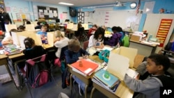 In this April 18, 2014 file photo, students are shown in a fourth-grade classroom at Olympic View Elementary School in Lacey, Washington. (AP Photo/Ted S. Warren)