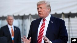 President Donald Trump speaks to reporters before leaving the White House in Washington for Greensboro, North Carolina, Oct. 7, 2017.