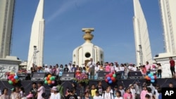 Thai anti-government protest leader Suthep Thaugsuban, center, makes a speech during the country's Children Day ceremony at the Democracy Monument Saturday, Jan. 11, 2014 in Bangkok, Thailand.