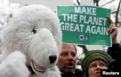 Environmental activists protest Myron Ebell, who leads U.S. President Donald Trump's Environmental Protection Agency's transition team, at the Solvay library in Brussels, Belgium, Feb. 1, 2017.