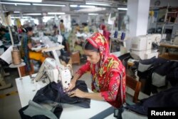 FILE - A worker is seen in a garment factory in Savar, Bangladesh, June 10, 2014.