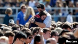 Students console one another at the University of California Santa Barbara during a memorial service in honor of the victims of the shooting there on May 27, 2014.