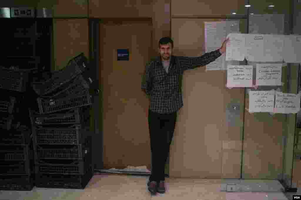 One of the hotel's 380 residents is seen on the first floor lobby. Meetings are held here allowing people to air their views. (J. Owens/VOA)