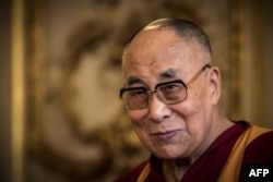 The Dalai Lama (C) is pictured during a meeting with the International Group of Information about Tibet in the French Senate premises in Paris, Sept. 14. 2016.