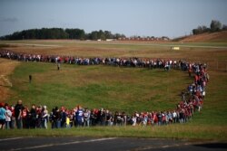 Supporters wait for the rally of U.S. President Donald Trump at Hickory Regional Airport in Hickory, North Carolina U.S., November 1, 2020.