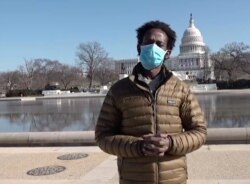 Roba Bulga, who studies conflict resolution, visits the Capitol Reflecting Pool days after the U.S. Capitol siege. (VOA Horn Service)