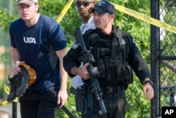 A member of the Congressional Republican softball team is allowed to leave the scene of a multiple shooting involving House Majority Whip Steve Scalise of La., June 14, 2017, in Alexandria, Va.