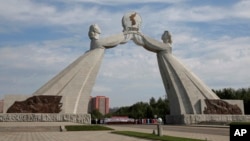 FILE - The Arch of Reunification, a monument to symbolize the hope for eventual reunification of the two Koreas, pictured in Pyongyang, North Korea, Sept, 11 ,2018. South Korean President Moon Jae-in is pushing hard to link the roads and railways of the the two Koreas.