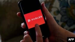 FILE - This photo shows the Parler logo on a smartphone in Arlington, Va., July 2, 2020. 