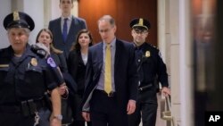 Mark Sandy, a career official in the White House Office of Management and Budget, arrives at the Capitol to testify in the House Democrats' impeachment inquiry against President Donald Trump, in Washington, Nov. 16, 2019.