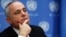 FILE - Minister of Strategic and Intelligence Affairs for International Relations of Israel Yuval Steinitz listens during a news conference.