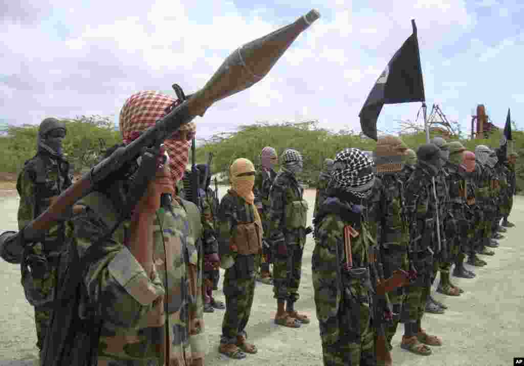 Al-Shabaab fighters brandish surface-to-air missiles and other weaponry during an Octoer, 2010 miliary exercise in Mogadishu. In addition to illicit ivory sales, Shabab has been financing their war against the western-backed government with charcoal exports to the Gulf Arab states with sales that have been banned by the United Nations.