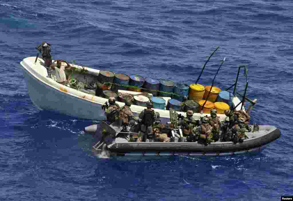 German marine forces as part of the European Union Naval Force Operation Atalanta, intercept a ship with suspected pirates off the coast of Tanzania, November 4, 2011.