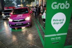 A Grab pick-up and drop-off station is seen at the entrance of Kuala Lumpur City Centre in Kuala Lumpur, Malaysia, Oct. 3, 2019.