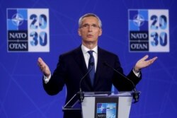 NATO Secretary General Jens Stoltenberg holds a news conference during a NATO summit
