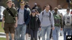 Students walk across campus at the University of Vermont, April 30, 2012 in Burlington, Vt.
