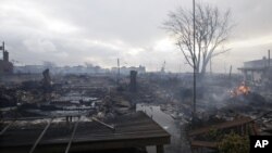 Damage caused by a fire at Breezy Point is shown in the New York City borough of Queens, October 30, 2012.