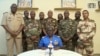 FILE - Colonel Major Amadou Abdramane makes a statement on July 26, 2023, in Niamey, Niger, as a delegation of military officers appeared on Niger state TV to announce their coup. Journalists have found it increasingly risky to report on the junta. (ORTN via AP)