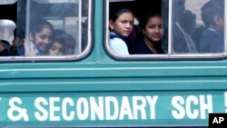 FILE - Kenyan students ride the bus to their school, Jan. 14, 2008.