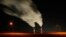 Smoke rising from the stacks of the La Cygne Generating Station coal-fired power plant in La Cygne, Kansas.