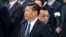 FILE - Chinese Premier Li Keqiang, right, walks past Chinese President Xi Jinping as they arrive to the Monument to the People's Heroes during a ceremony marking Martyr’s Day at Tiananmen Square in Beijing, Sept. 30, 2014. 