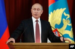 Russian Vladimir Putin speaks during a meeting with Russian ambassadors to foreign countries in Moscow, Russia, July 19, 2018.