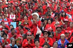 FILE - In this May 19, 2012, file photo, "red shirts" protesters attend a prayer session during a rally at Ratchaprasong Intersection in Bangkok, Thailand. The Red Shirts rose in response after Thaksin was ousted in a September 2006 military coup. (AP)