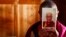 FILE - A monk is seen holding a picture of Tibetan spiritual leader Dalai Lama.