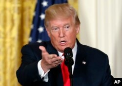 FILE - In this photo taken Aug. 28, 2017, President Donald Trump speaks in the East Room of the White House in Washington. Trump later said "all options are on the table" in terms of a U.S. response to North Korea's launch of a missile over Japan.