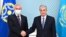 Kazakhstan's President Kassym-Jomart Tokayev, right, shakes hands with the secretary-general of the Collective Security Treaty Organization, Stanislav Zas, prior to their talks in Nur-Sultan, Kazakhstan, Jan. 12, 2022. (Kazakhstan's Presidential Press Service via AP)
