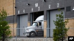 A truck is shown at the Pfizer Global Supply Kalamazoo manufacturing plant in Portage, Mich., Saturday, Dec. 12, 2020. (AP Photo/Paul Sancya)
