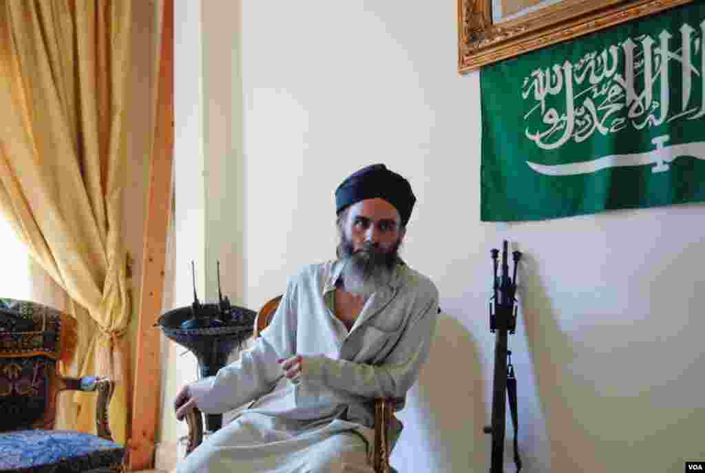 Sheikh Bilal Masri rests in his Bab Tabbaneh home during a lull in fighting in Tripoli, Lebanon, August 23, 2012. (VOA/Jeff Neumann)