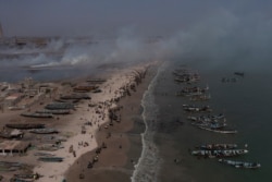 Fishing boats line the shore of Bargny beach, Senegal, Apr. 22, 2021.