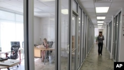 Workers inside one of the business incubator buildings of the Charleston Digital Corridor in Charleston, S.C., are seen in this photo taken on Thursday, Oct. 25, 2012. 