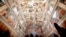 Visitors admire the Sistine Chapel of the Vatican Museums as the museum reopens, in Rome, Italy, May 3, 2021.