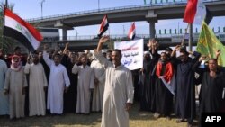 Iraqi protesters take part in anti-government demonstrations in the central city of Najaf, Oct. 25, 2019.
