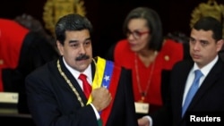 Venezuela's President Nicolas Maduro gestures during a ceremony to mark the opening of the judicial year at the Supreme Court of Justice (TSJ), in Caracas, Venezuela, Jan. 24, 2019.