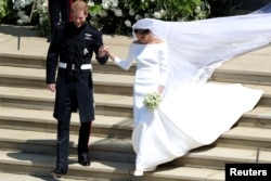 Prince Harry and Meghan Markle leave St. George's Chapel in Windsor Castle after their wedding in Windsor, Britain, May 19, 2018.