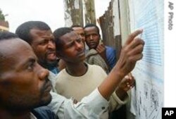 Ethiopian voters check 2005 provisional results at a polling station in Addis Ababa 16 May 2005