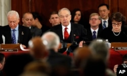FILE - Senate Judiciary Committee Chairman Sen. Charles Grassley, R-Iowa, (C), flanked by the committee's ranking member, Sen. Dianne Feinstein, D-Calif., (R), and Sen. Orrin Hatch, R-Utah, questions Attorney General-designate, Sen. Jeff Sessions, R-Ala., on Capitol Hill in Washington, Jan. 10, 2017,