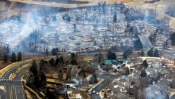 Burned homes in a Boulder County neighborhood destroyed by a wind driven wildfire are seen from a Colorado National Guard helicopter, Dec. 31, 2021.