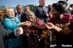 U.S. Democratic presidential nominee Hillary Clinton greets tailgaters at the Bethune-Cookman University Wildcats homecoming football game in Daytona Beach, Fla., Oct. 29, 2016.